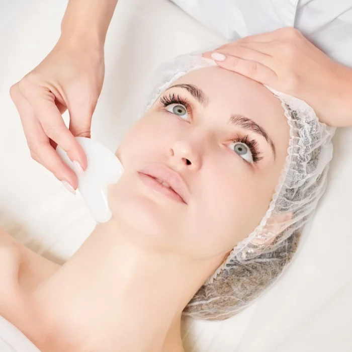 beautician-making-facial-massage-with-gua-sha-ston-2023-11-27-05-33-42-utc beautician-making-facial-massage-with-gua-sha-ston-2023-11-27-05-33-42-utc